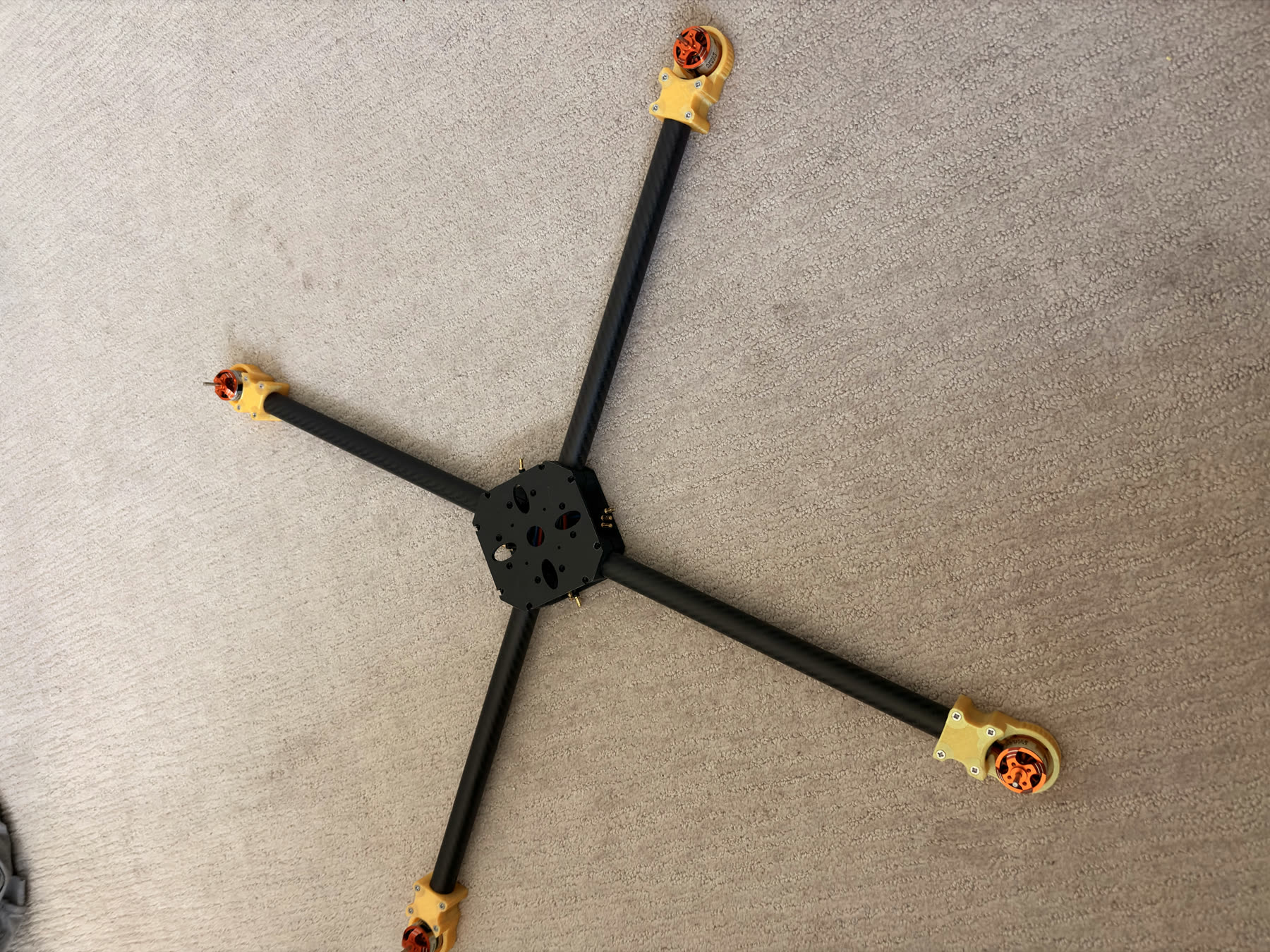 Dry-fit autonomous quadcopter frame with carbon-fiber arms and motor mounts.